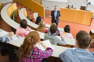 School safety software- teacher with students sitting at the college lecture hall